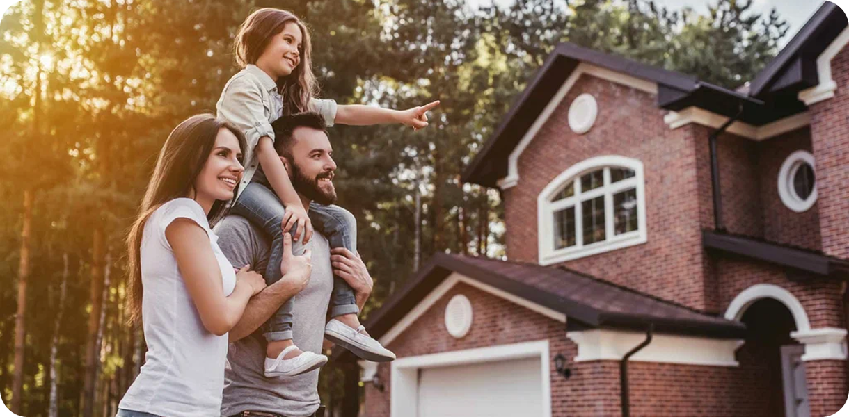 Family in front of their new home
